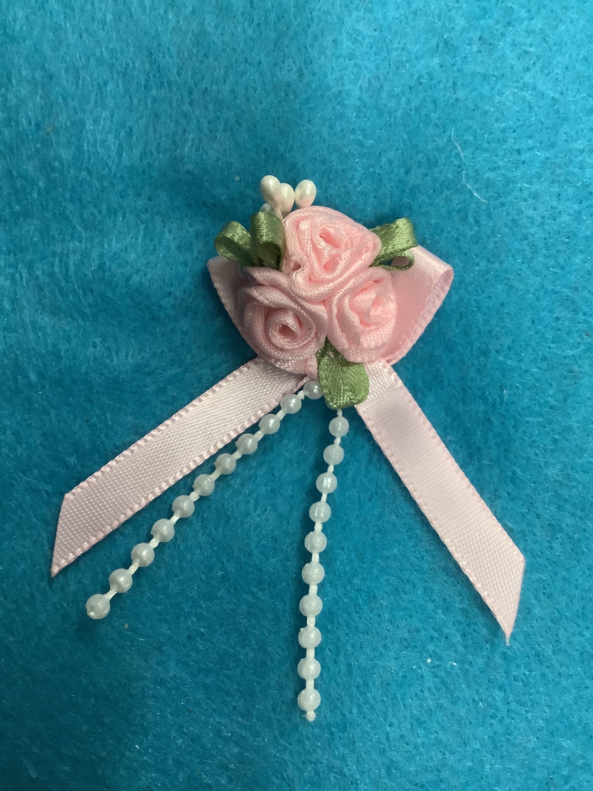 Baby Pink Ribbon Flowers with Green Leaves , long ribbons and beads